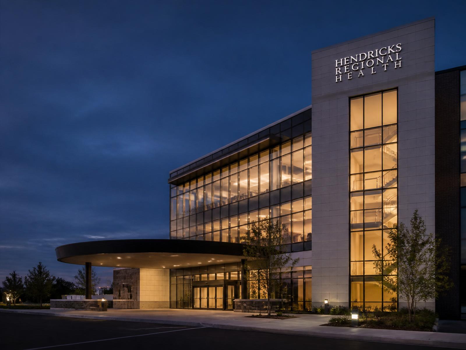 Modern regional healthcare facility at dusk